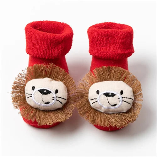 Pair of red knitted socks featuring festive lion designs on the toe area.