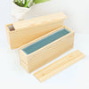 A wooden box and lid for a silicone rectangle soap mold is shown on a white surface.