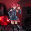 A PVC figure of Hatsune Miku with red hair and a blue outfit posing against a dark background.