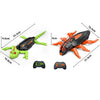 Wall-climbing RC gecko toy in green and black with orange limbs and a controller