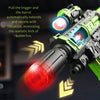 A close-up of an LED light-up water mist blaster toy gun firing, showing the barrel extending and recoil vibration.