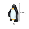 A black and white penguin building block with dimensions 5.5cm high and 3cm long.