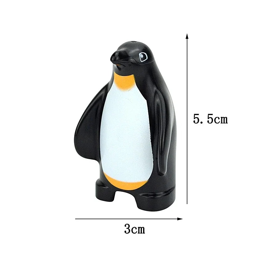 A black and white penguin building block with dimensions 5.5cm high and 3cm long.