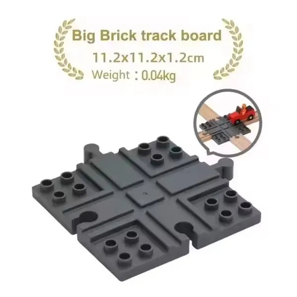 A gray big brick track board with interlocking pieces and a small red train model.