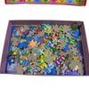 A 200-piece jigsaw puzzle depicting the USA and World Map, featuring various colored pieces.