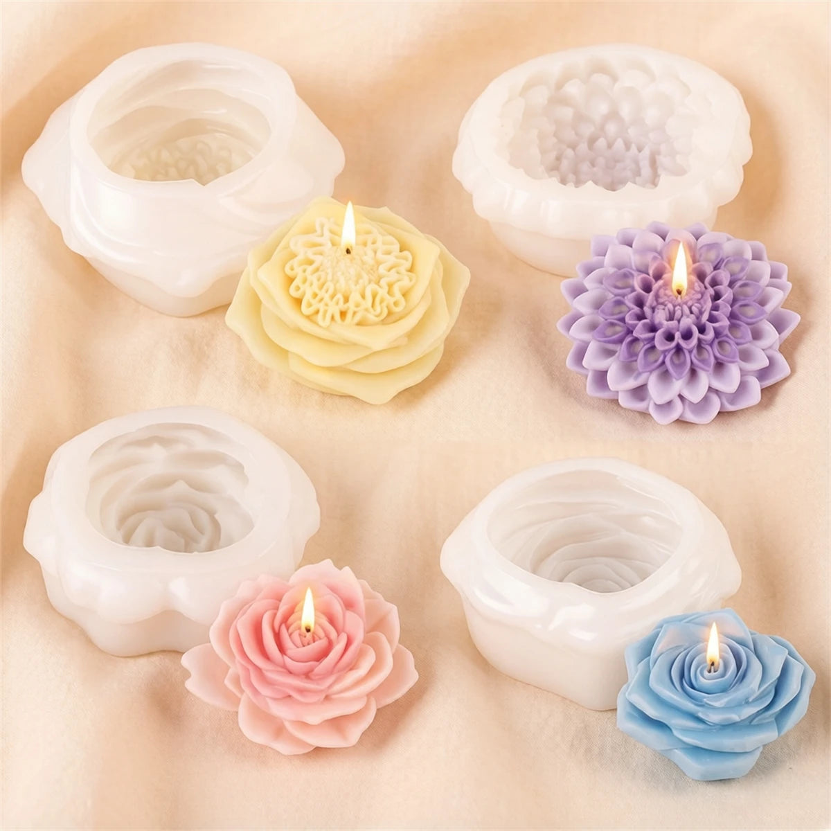 A collection of white and purple silicone candle molds shaped like flowers, including roses and dahlia patterns.