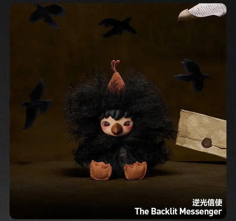 A black fluffy creature with large eyes and a nose is shown against a dark background.