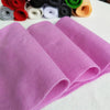 A stack of vibrant purple felt fabric sheets rolled up for DIY crafts and sewing projects.