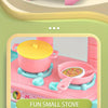A pink mini pretend play kitchen set featuring a yellow pot and cooking accessories on a light-colored surface.