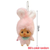 Pink fluffy cartoon plush keychain charm with a small face and a hanging chain