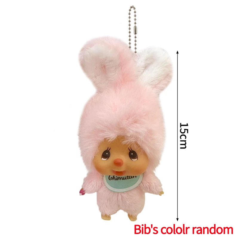Pink fluffy cartoon plush keychain charm with a small face and a hanging chain