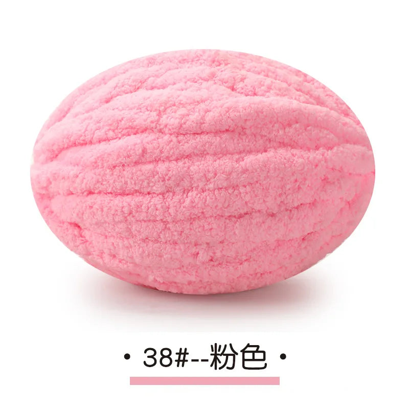 Pink chunky chenille yarn ball for hand knitting projects