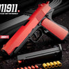 A red automatic shell-ejecting fidget pistol toy is shown with ammunition and parts on a dark surface.