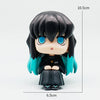 A figure set of Tanjiro and Nezuko from Demon Slayer, featuring black hair, teal accents, and large blue eyes.