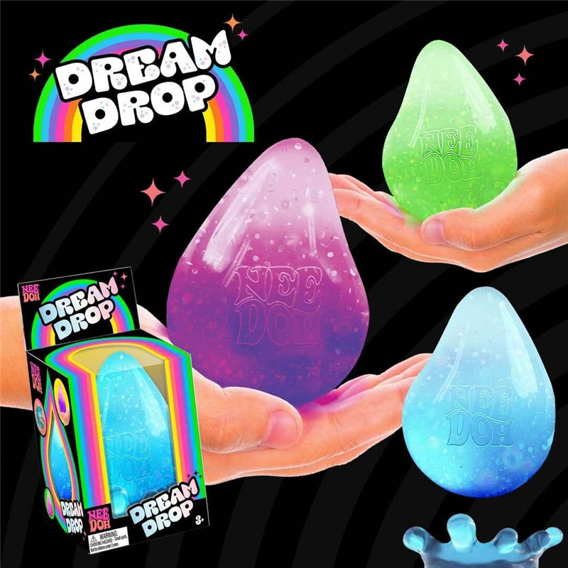 Hands display three translucent squishy toys in shades of pink, green, and blue against a black background.