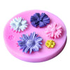 Pink silicone mold with six purple and pink flowers for decorating fondant, cake, or chocolate