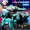 A black and teal RC stunt tank is shown with a remote control, batteries, and accessories.