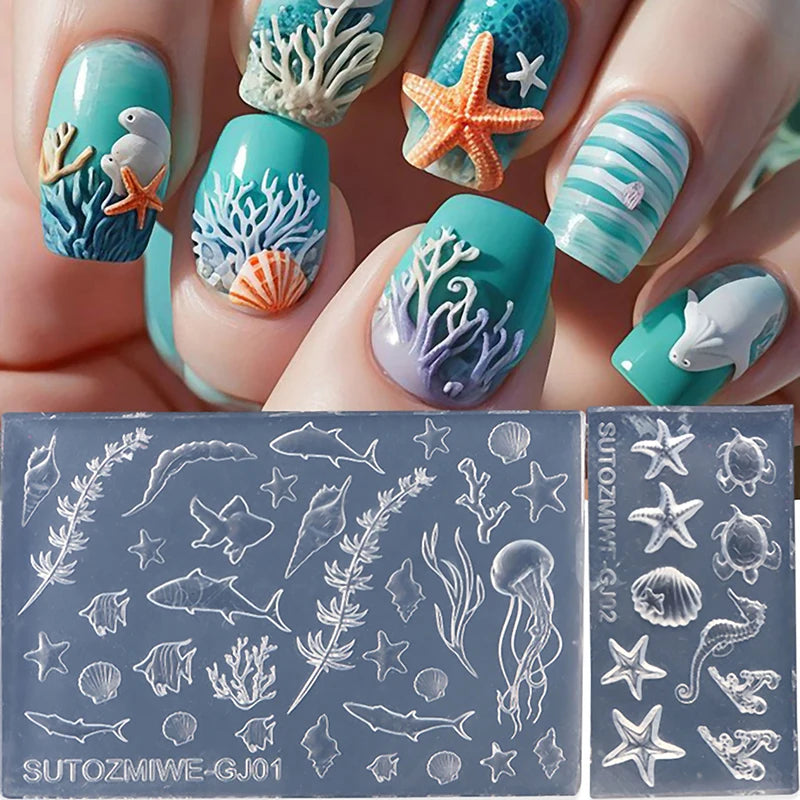 A hand displays various silicone nail art molds featuring sea creatures like starfish, coral, and fish in shades of blue and 