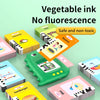A colorful interactive talking flash card learning machine with various food and object cards shown on a light green backgrou