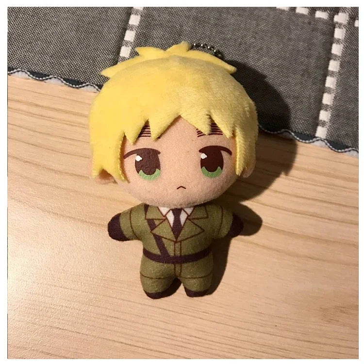 A plush keychain set featuring three characters: Arthur, Alfred, and Wang Yao, with yellow hair and green outfits.