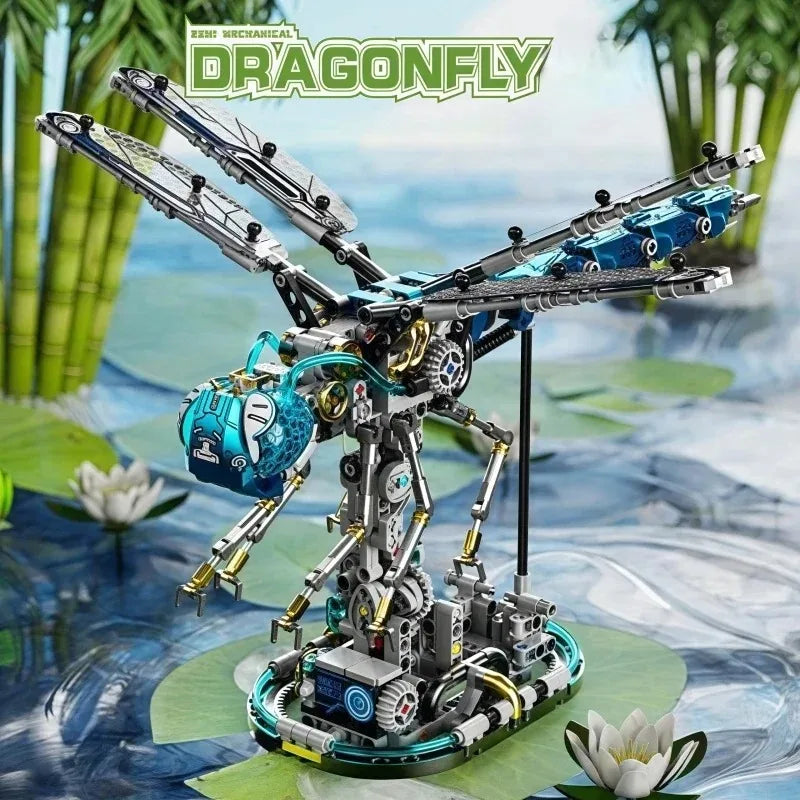 A detailed mechanical model of a dragonfly, featuring intricate silver and blue components, displayed on a green surface.