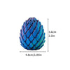 A blue, scale-like 3D printed expandable dragon egg fidget toy.