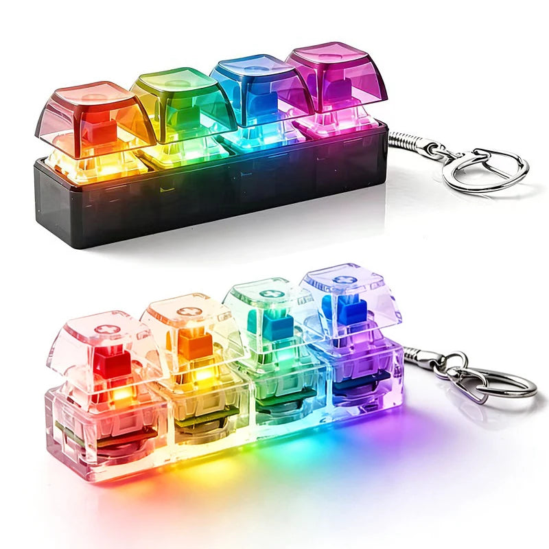 A set of illuminated keyboard key fidget toys in various colors, packaged with a metal keychain.