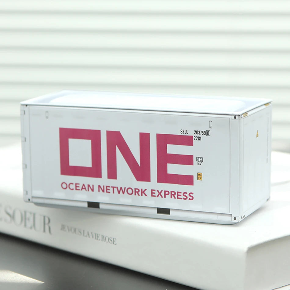 A white industrial storage box labeled ONE Ocean Network Express resting on a white surface.