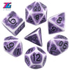 A set of purple and white polyhedral dice including d20, d8, d10, d6, d12, and d100 dice.