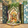 A DIY wooden floral book nook kit featuring an arched display with natural elements and LED lighting.