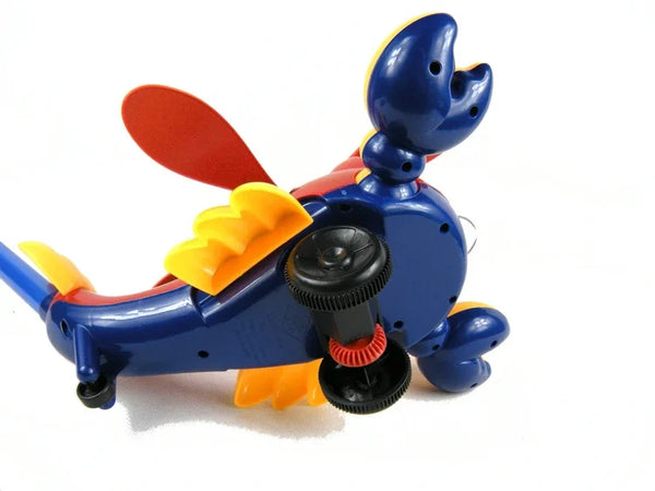 A blue kids' push plane toy featuring an orange wing and yellow tongue ring.