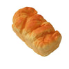 A golden-brown, squeezable bread-shaped toy used for stress relief and sensory play.