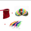 A set of colorful magical trick bags with red fabric and various colored streamers for stage performance.