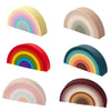 A collection of colorful silicone rainbow building blocks in various shades and angles.