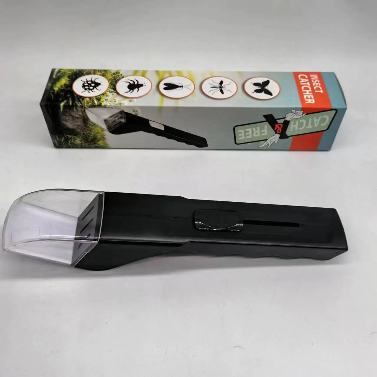 A black handheld insect catcher with a clear magnifying lens is shown next to its retail box.