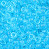 A pile of small, clear blue pony beads for jewelry making and craft projects.