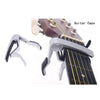 Silver aluminium alloy quick-release guitar capo clamped onto a guitar fretboard
