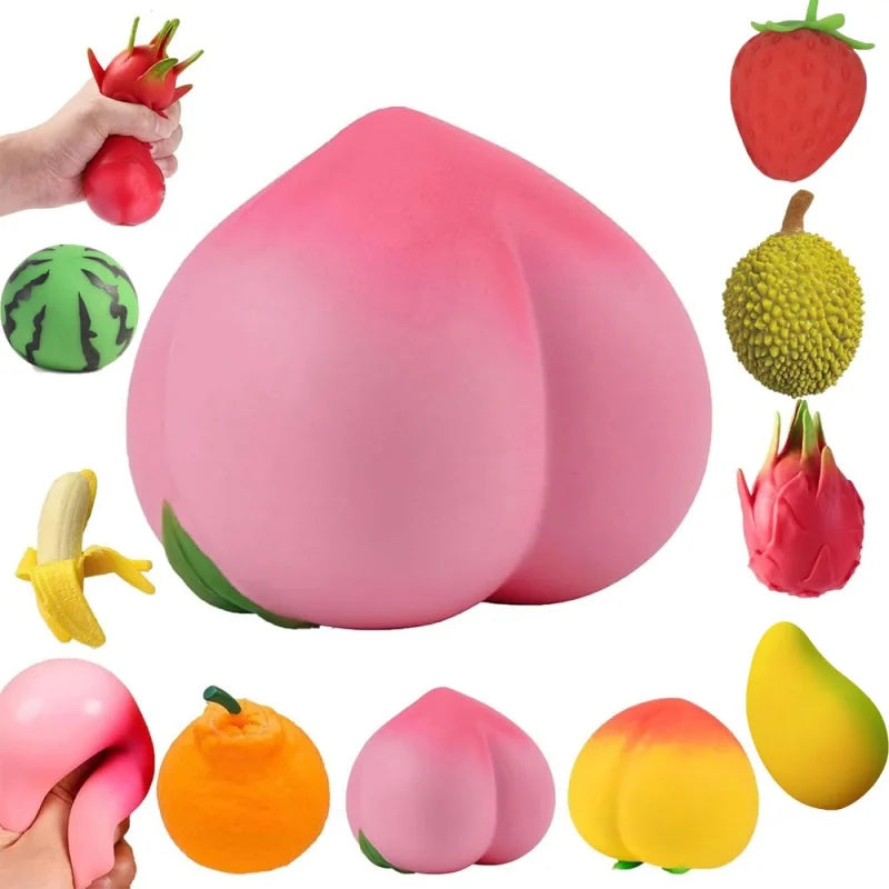 A collection of pink and yellow fruit squishy toys including a strawberry, a melon, a peach, and a pear.