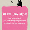 A pink sticky note with the text 10 Pcs (any style) and a black cat drawing on top.