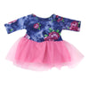 A handmade doll dress featuring a dark blue floral print with pink accents and a tulle skirt.