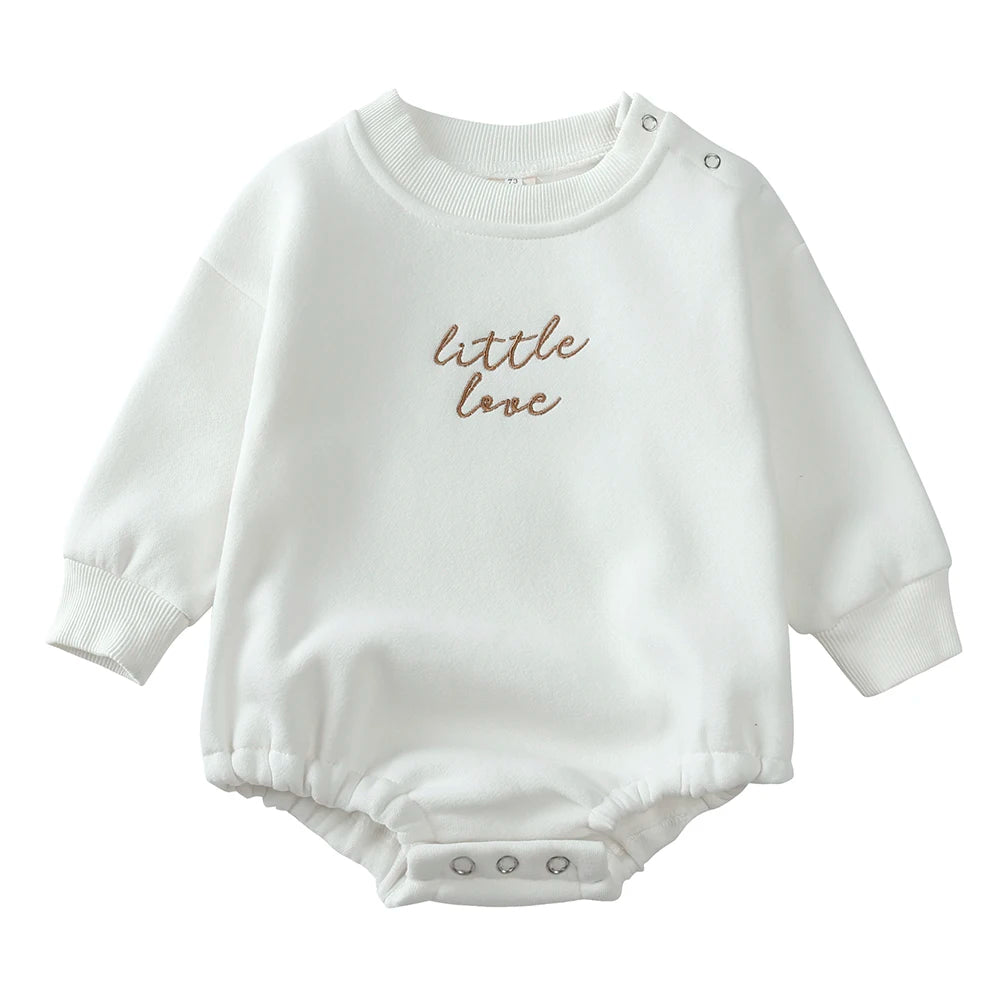 White cotton baby romper with 'little love' embroidery on the chest