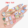 A hand displays a set of 20 enamel marine life charms for jewelry making, featuring various sea creatures and items.