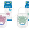 A set of Dr Brown's soft silicone baby pacifiers and soothers in pink and green colors.