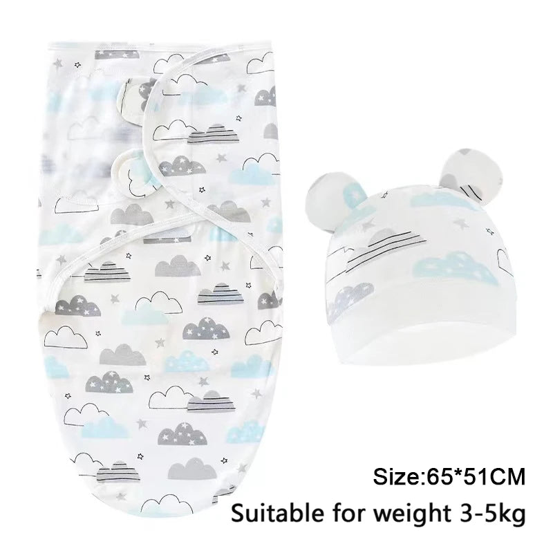 White cotton newborn swaddle blanket and hat set featuring clouds and stripes for a baby