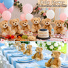 A collection of plush teddy bears and pink balloons used for baby shower decorations and guest gifts.