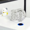A clear crystal fidget twist rope is displayed next to a white cat figurine on a white surface.