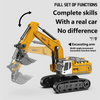 A yellow 1:64 scale remote control excavator with an articulating arm is shown.