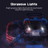 A dark, rugged 1:18 scale off-road RC monster truck with bright LED lights illuminating the way.