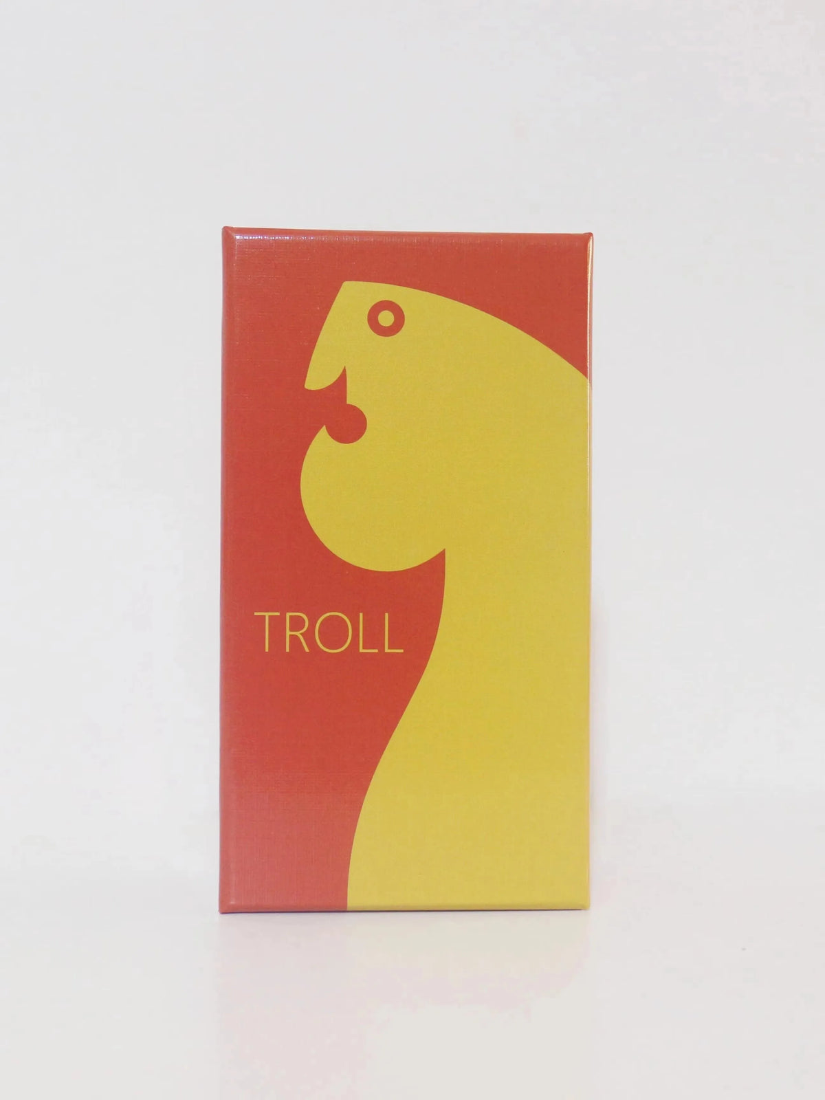 A rectangular box featuring a yellow silhouette of a troll's head on a red background with the word TROLL printed in black.