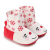 Pair of adorable animal-themed baby first walker shoes with red and white snowflake patterns